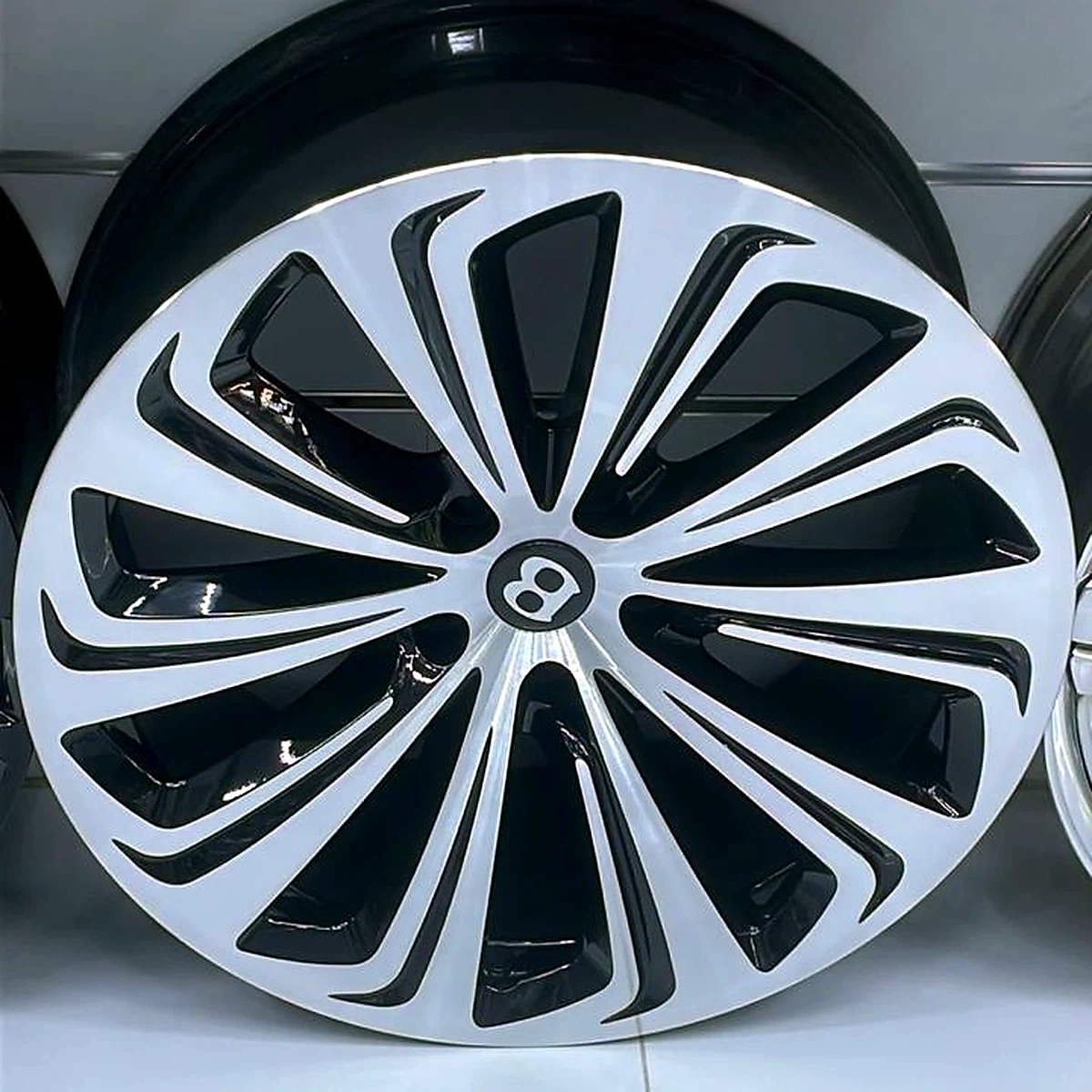 Bentley swept-spoke machined and black wheel
